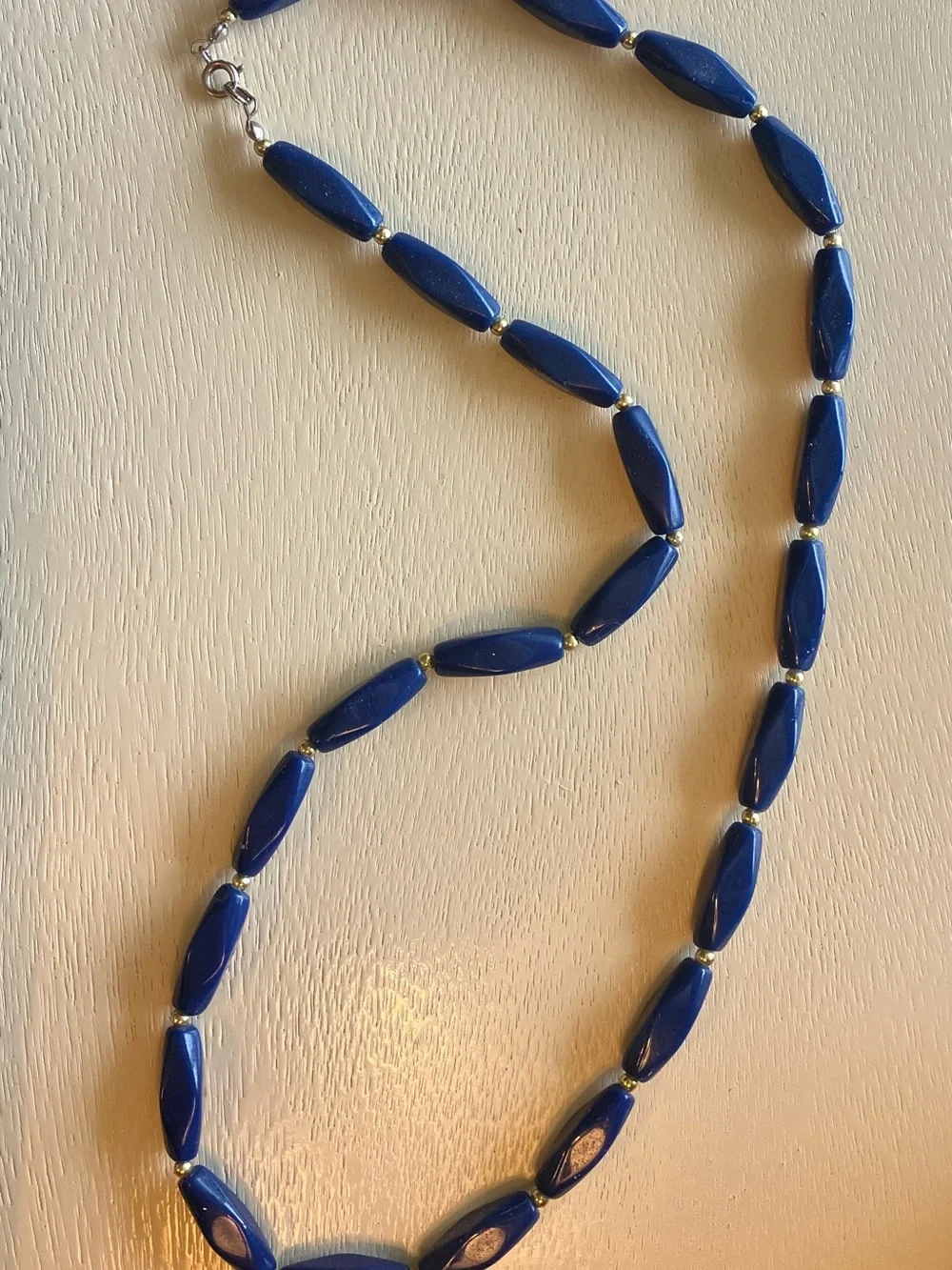 Mod retro dark blue vintage lucite necklace with gold spacer beads